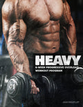 Muscular person holding a dumbbell with 'HEAVY' workout program text overlay